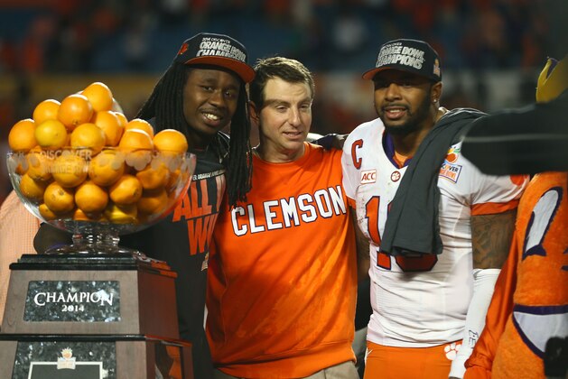 MIAMI GARDENS, FL - JANUARY 03:  (L-R) Sammy Watkins #2, head coach Dabo Swinney and Tajh Boyd #10 of the Clemson Tigers celebrate after defeating the Ohio State Buckeyes during the Discover Orange Bowl at Sun Life Stadium on January 3, 2014 in Miami Gardens, Florida. Clemson defeated Ohio State 40-35.  (Photo by Streeter Lecka/Getty Images)