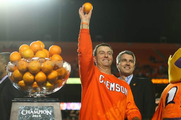 MIAMI GARDENS, FL - JANUARY 03:  Head coach Dabo Swinney of the Clemson Tigers holds up an orange after defeating the Ohio State Buckeyes during the Discover Orange Bowl at Sun Life Stadium on January 3, 2014 in Miami Gardens, Florida. Clemson defeated Ohio State 40-35.  (Photo by Mike Ehrmann/Getty Images)