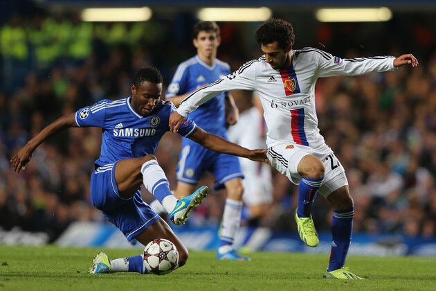 LONDON, ENGLAND - SEPTEMBER 18: John Obi Mikel of Chelsea and Mohamed Salah of FC Basel battle for the ball  during the UEFA Champions League Group E Match between Chelsea and FC Basel at Stamford Bridge on September 18, 2013 in London, England.  (Photo by Ian Walton/Getty Images)