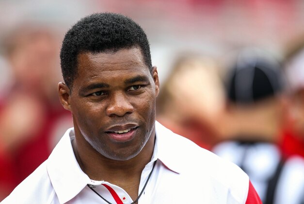 September 29, 2012; Athens, GA, USA; Georgia Bulldogs former player Herschel Walker on the sidelines before the game against the Tennessee Volunteers at Sanford Stadium. The Bulldogs won 51-44. Mandatory Credit: Daniel Shirey-USA TODAY Sports September 29, 2012; Athens, GA, USA; Georgia Bulldogs former player Herschel Walker on the sidelines before the game against the Tennessee Volunteers at Sanford Stadium. The Bulldogs won 51-44. Mandatory Credit: Daniel Shirey-USA TODAY Sports