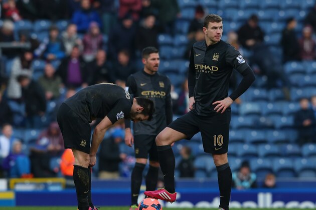BLACKBURN, ENGLAND - JANUARY 04:  Edin Dzeko and Alvaro Negredo of Manchester City look on after conceding a goal during the Budweiser FA Cup third round match between Blackburn Rovers and Manchester City at Ewood Park on January 4, 2014 in Blackburn, England.  (Photo by Alex Livesey/Getty Images)