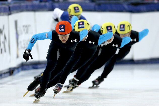 SALT LAKE CITY, UT - JANUARY 03: J.R. Celski #705 (red helmet) leads the field in the first men's 1,500 meter final during the U.S. Olympic Short Track Trials at the Utah Olympic Oval on January 3, 2014 in Salt Lake City, Utah.  (Photo by Matthew Stockman/Getty Images)
