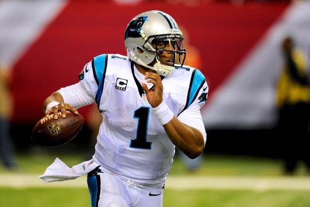 Dec 29, 2013; Atlanta, GA, USA; Carolina Panthers quarterback Cam Newton (1) runs with the ball against the Atlanta Falcons during the second half at the Georgia Dome. The Panthers defeated the Falcons 21-20. Mandatory Credit: Dale Zanine-USA TODAY Sports