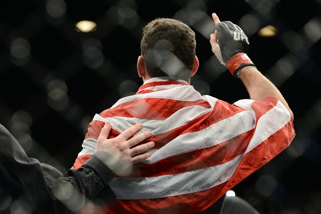 Dec 28, 2013; Las Vegas, NV, USA;    Chris Weidman reacts in the cage after defeating Anderson Silva (not pictured) in their UFC middleweight championship bout at the MGM Grand Garden Arena. Mandatory Credit: Jayne Kamin-Oncea-USA TODAY Sports