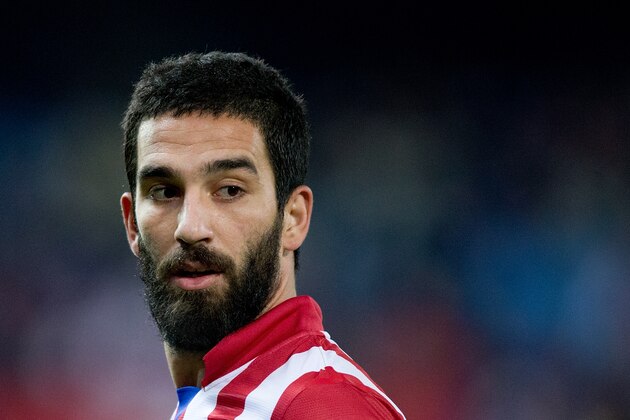 MADRID, SPAIN - DECEMBER 21: Arda Turan of Atletico de Madrid looks on during the La Liga match between Club Atletico de Madrid and Levante UD at Vicente Calderon Stadium on December 21, 2013 in Madrid, Spain.  (Photo by Gonzalo Arroyo Moreno/Getty Images)