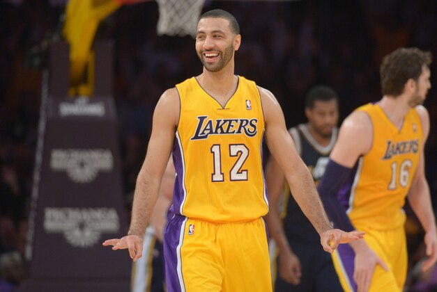 Jan 3, 2014; Los Angeles, CA, USA; Los Angeles Lakers guard Kendall Marshall (12) celebrates after a 3-point basket in the final minute against the Utah Jazz at Staples Center. The Lakers defeated the Jazz 110-99. Mandatory Credit: Kirby Lee-USA TODAY Sports