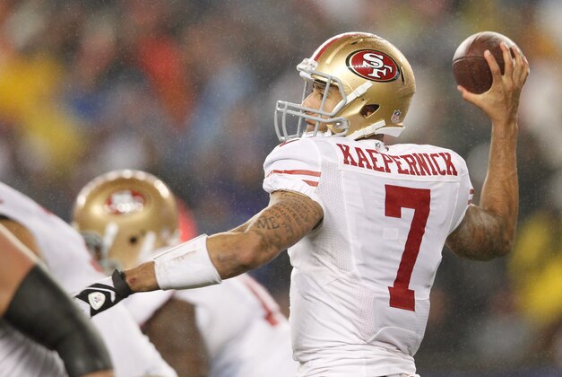 Dec 16, 2012; Foxboro, Massachusetts, USA; San Francisco 49ers quarterback Colin Kaepernick (7) passes the ball against The New England Patriots during the fourth quarter at Gillette Stadium. The San Francisco 49ers won 41-34.  Mandatory Credit: Greg M. Cooper-USA TODAY Sports