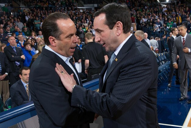 Jan 4, 2014; South Bend, IN, USA; Notre Dame Fighting Irish head coach Mike Brey and Duke Blue Devils head coach Mike Krzyzewski chat before the game at the Purcell Pavilion. Notre Dame won 79-77. Mandatory Credit: Matt Cashore-USA TODAY Sports