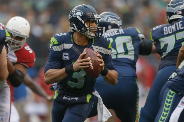 SEATTLE, WA - DECEMBER 22: Quarterback Russell Wilson #3 of the Seattle Seahawks looks downfield to pass against the Arizona Cardinals at CenturyLink Field on December 22, 2013 in Seattle, Washington. (Photo by Otto Greule Jr/Getty Images) SEATTLE, WA - DECEMBER 22: Quarterback Russell Wilson #3 of the Seattle Seahawks looks downfield to pass against the Arizona Cardinals at CenturyLink Field on December 22, 2013 in Seattle, Washington. (Photo by Otto Greule Jr/Getty Images)