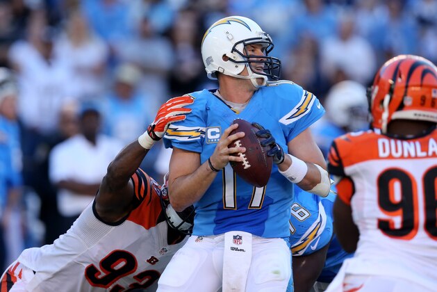 SAN DIEGO, CA - DECEMBER 01:  Quarterback Philip Rivers #17 of the San Diego Chargers trys to pass against the rush of defensive tackle Domata Peko #93 of Cincinnati Bengals at Qualcomm Stadium on December 1, 2013 in San Diego, California. The Bengals won 17-10.  (Photo by Stephen Dunn/Getty Images)