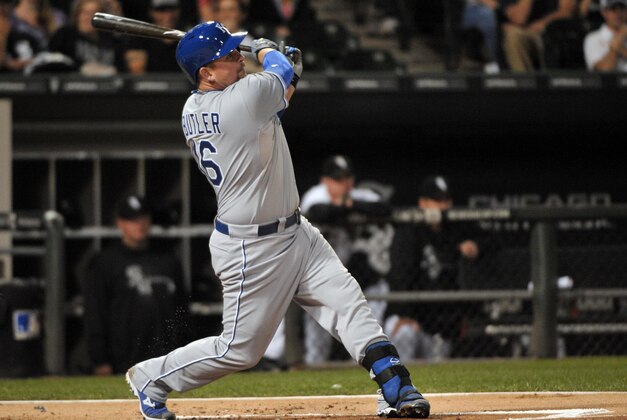 Sep 27, 2013; Chicago, IL, USA; Kansas City Royals designated hitter Billy Butler (16) hits a two run RBI double against the Chicago White Sox during the first inning at U.S Cellular Field. Mandatory Credit: Rob Grabowski-USA TODAY Sports