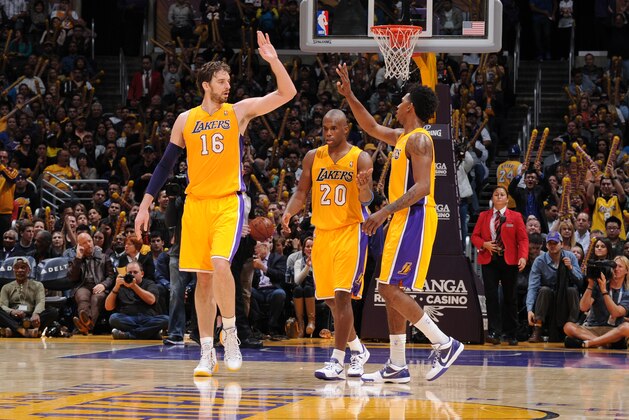 LOS ANGELES, CA - JANUARY 3: Pau Gasol #16 and Nick Young #0 of the Los Angeles Lakers high five during a game against the Utah Jazz at STAPLES Center on January 3, 2013 in Los Angeles, California. NOTE TO USER: User expressly acknowledges and agrees that, by downloading and/or using this Photograph, user is consenting to the terms and conditions of the Getty Images License Agreement. Mandatory Copyright Notice: Copyright 2013 NBAE (Photo by Andrew D. Bernstein/NBAE via Getty Images)