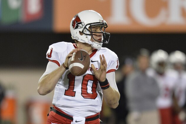 DEKALB, IL - NOVEMBER 13:  Quarterback Keith Wenning #10 of the Ball State Cardinals drops back to pass during the second quarter against the Northern Illinois Huskies at Huskie Stadium on November 13, 2013 in DeKalb, Illinois.  (Photo by Brian Kersey/Getty Images)