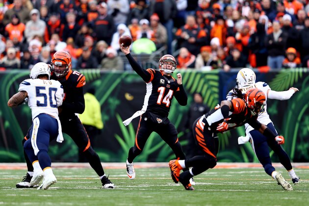 CINCINNATI, OH - JANUARY 05:  Quarterback Andy Dalton #14 of the Cincinnati Bengals passes against the San Diego Chargers during a Wild Card Playoff game at Paul Brown Stadium on January 5, 2014 in Cincinnati, Ohio.  (Photo by Andy Lyons/Getty Images)