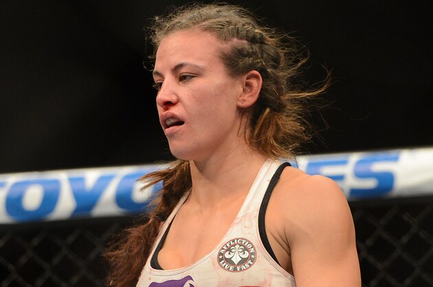 Dec 28, 2013; Las Vegas, NV, USA;   Miesha Tate in the cage after being defeated by Ronda Rousey (not pictured) in their UFC Women's Bantamweight Championship Bout at the MGM Grand Garden Arena. Rousey won with an arm bar in the third round. Mandatory Credit: Jayne Kamin-Oncea-USA TODAY Sports