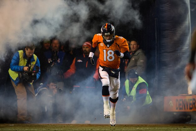 DENVER, CO - DECEMBER 12: Quarterback Peyton Manning #18 of the Denver Broncos emerges from the tunnel during player introductions before a game against the San Diego Chargers at Sports Authority Field Field at Mile High on December 12, 2013 in Denver, Colorado. (Photo by Dustin Bradford/Getty Images) DENVER, CO - DECEMBER 12: Quarterback Peyton Manning #18 of the Denver Broncos emerges from the tunnel during player introductions before a game against the San Diego Chargers at Sports Authority Field Field at Mile High on December 12, 2013 in Denver, Colorado. (Photo by Dustin Bradford/Getty Images)