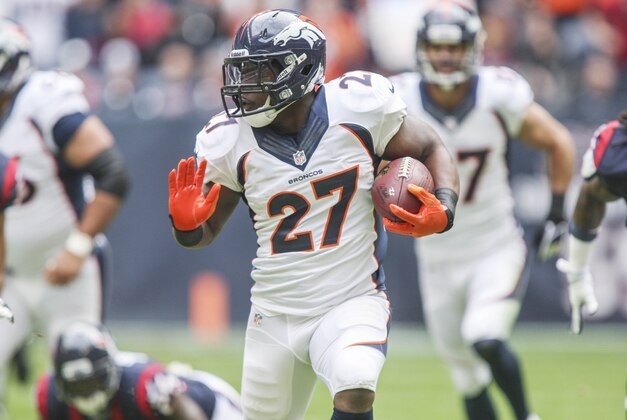 Dec 22, 2013; Houston, TX, USA; Denver Broncos running back Knowshon Moreno (27) rushes during the first quarter against the Houston Texans at Reliant Stadium. Mandatory Credit: Troy Taormina-USA TODAY Sports