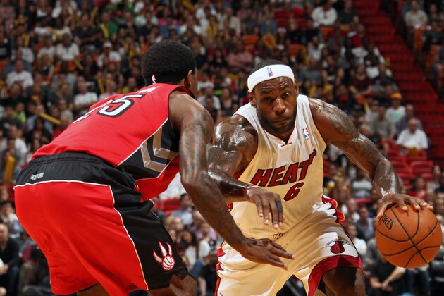 MIAMI, FL - JANUARY 5:  LeBron James #6 of the Miami Heat handles the ball against the Toronto Raptors at the American Airlines Arena in Miami, Florida on Jan. 5, 2014. NOTE TO USER: User expressly acknowledges and agrees that, by downloading and/or using this photograph, user is consenting to the terms and conditions of the Getty Images License Agreement. Mandatory copyright notice: Copyright NBAE 2014 (Photo by Issac Baldizon/NBAE via Getty Images)