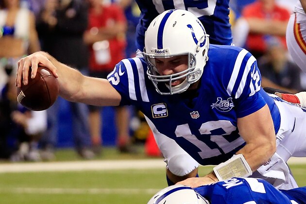 INDIANAPOLIS, IN - JANUARY 04: Quarterback Andrew Luck #12 of the Indianapolis Colts scores a touchdown in the fourth quarter after recovering a fumble against the Kansas City Chiefs during a Wild Card Playoff game at Lucas Oil Stadium on January 4, 2014 in Indianapolis, Indiana.  (Photo by Rob Carr/Getty Images)