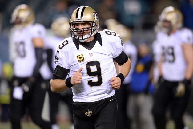 Jan 4, 2014; Philadelphia, PA, USA; New Orleans Saints quarterback Drew Brees (9) warms up before the 2013 NFC wild card playoff football game against the Philadelphia Eagles at Lincoln Financial Field. Mandatory Credit: Joe Camporeale-USA TODAY Sports