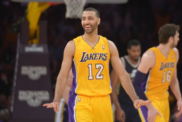 Jan 3, 2014; Los Angeles, CA, USA; Los Angeles Lakers guard Kendall Marshall (12) celebrates after a 3-point basket in the final minute against the Utah Jazz at Staples Center. The Lakers defeated the Jazz 110-99. Mandatory Credit: Kirby Lee-USA TODAY Sports