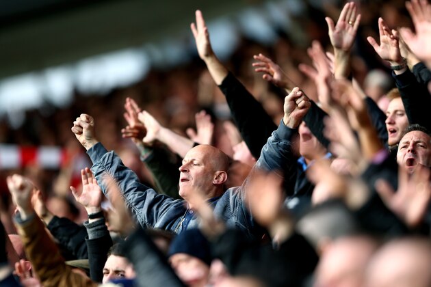 SOUTHAMPTON, ENGLAND - DECEMBER 22:  Fans cheer on their team during the Barclays Premier League match between Southampton and Tottenham Hotspur at St Mary's Stadium on December 22, 2013 in Southampton, England.  (Photo by Paul Gilham/Getty Images)