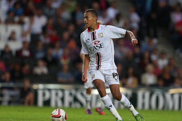 MILTON KEYNES, ENGLAND - JULY 31:  Dele Alli of MK Dons in action during the Pre-Season Friendly match between MK Dons and Tottenham Hotspur XI at Stadium mk on July 31, 2013 in Milton Keynes, England.  (Photo by Pete Norton/Getty Images)