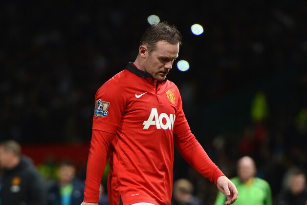 MANCHESTER, ENGLAND - JANUARY 01:  Wayne Rooney of Manchester United walks off at the end of the Barclays Premier League match between Manchester United and Tottenham Hotspur at Old Trafford on January 1, 2014 in Manchester, England.  (Photo by Michael Regan/Getty Images)