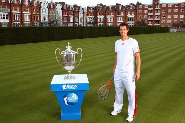 LONDON, ENGLAND - APRIL 10:  Andy Murray of Great Britain poses with the AEGON Championships Trophy on the day that he committed playing at the Queen's Club for the next five years. Murray was at a tournament launch for the AEGON Championships at the Queen's Club on April 10, 2012 in London, England.  (Photo by Julian Finney/Getty Images for The LTA)