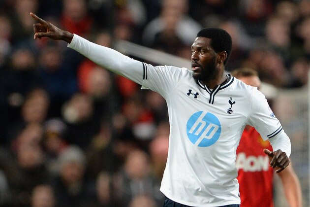 MANCHESTER, ENGLAND - JANUARY 01:  Emmanuel Adebayor of Tottenham Hotspur celebrates scoring the opening goal during the Barclays Premier League match between Manchester United and Tottenham Hotspur at Old Trafford on January 1, 2014 in Manchester, England.  (Photo by Michael Regan/Getty Images)