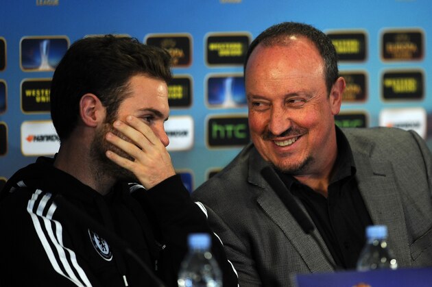 LONDON, ENGLAND - MAY 01:  Juan Mata (L) of Chelsea whispers to Interim Manager Rafa Benitez after he is asked questions about Benitez's management and future of the club during the Chelsea Press Conference at Stamford Bridge on May 1, 2013 in London, England.  (Photo by Christopher Lee/Getty Images)