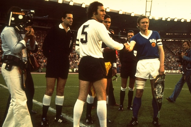 1960:  West Germany Captain Franz Beckenbauer #5 shakes hands with the East Germany Captain before a match. \ Mandatory Credit: Allsport UK /Allsport