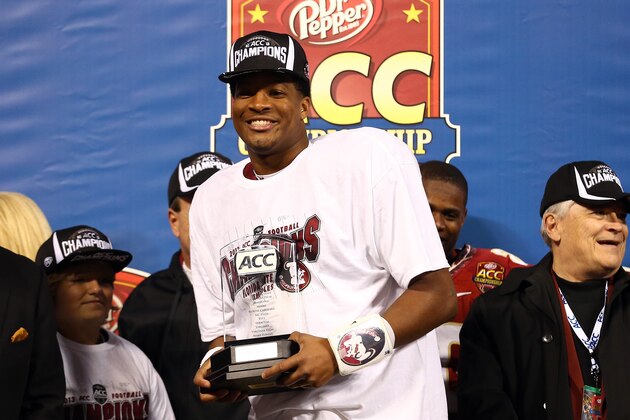 CHARLOTTE, NC - DECEMBER 07:  Quarterback Jameis Winston #5 of the Florida State Seminoles celebrates on stage after defeating the Duke Blue Devils 45-7 in the ACC Championship game at Bank of America Stadium on December 7, 2013 in Charlotte, North Carolina.  (Photo by Streeter Lecka/Getty Images)