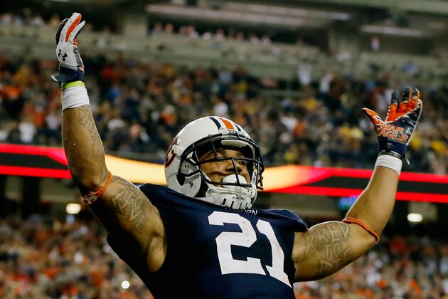 ATLANTA, GA - DECEMBER 07:  Tre Mason #21 of the Auburn Tigers celebrates his fourth quarter touchdown against the Missouri Tigers during the SEC Championship Game at Georgia Dome on December 7, 2013 in Atlanta, Georgia.  (Photo by Kevin C. Cox/Getty Images)