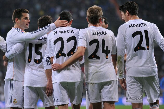 MADRID, SPAIN - DECEMBER 18:  Angel di Maria of Real Madrid celebrates with  Jose Ignacio 'Nacho' (L), Asier Illarramendi  alias 'Illara' and Alvaro Morata after scoring Real's 2nd goal during the Copa del Rey, Round of 32 2nd leg match between Real Madrid and Olimpic de Xativa at Santiago Bernabeu stadium on December 18, 2013 in Madrid, Spain.  (Photo by Denis Doyle/Getty Images)