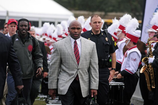 Dec 28, 2013; Orlando, FL, USA; Louisville Cardinals head coach Charlie Strong walks in before the Russell Athletic Bowl at Florida Citrus Bowl Stadium. Mandatory Credit: David Manning-USA TODAY Sports