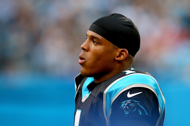 CHARLOTTE, NC - DECEMBER 22:   Cam Newton #1 of the Carolina Panthers watches on during their game against the New Orleans Saints at Bank of America Stadium on December 22, 2013 in Charlotte, North Carolina.  (Photo by Streeter Lecka/Getty Images)