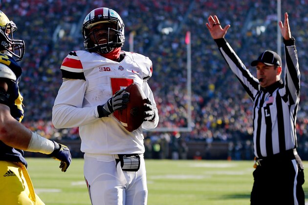 ANN ARBOR, MI - NOVEMBER 30: Quarterback Braxton Miller #5 of the Ohio State Buckeyes scores a touchdown in the third quarter against the Michigan Wolverines during a game at Michigan Stadium on November 30, 2013 in Ann Arbor, Michigan. (Photo by Gregory Shamus/Getty Images) ANN ARBOR, MI - NOVEMBER 30: Quarterback Braxton Miller #5 of the Ohio State Buckeyes scores a touchdown in the third quarter against the Michigan Wolverines during a game at Michigan Stadium on November 30, 2013 in Ann Arbor, Michigan. (Photo by Gregory Shamus/Getty Images)