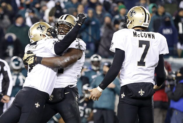 Jan 4, 2014; Philadelphia, PA, USA; New Orleans Saints kicker Shayne Graham (3) celebrates with Saints tight end Benjamin Watson (82) after kicking the game winning field goal in the fourth quarter against the Philadelphia Eagles in the 2013 NFC wild card playoff football game at Lincoln Financial Field. The Saints won 26-24. Mandatory Credit: Geoff Burke-USA TODAY Sports