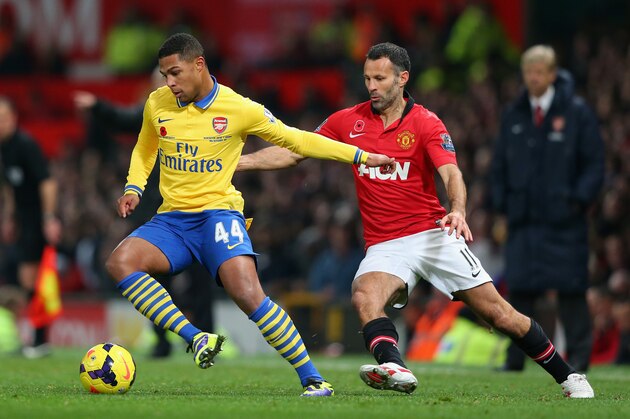MANCHESTER, ENGLAND - NOVEMBER 10:  Ryan Giggs of Manchester United competes with Serge Gnabry of Arsenal during the Barclays Premier League match between Manchester United and Arsenal at Old Trafford on November 10, 2013 in Manchester, England.  (Photo by Alex Livesey/Getty Images)