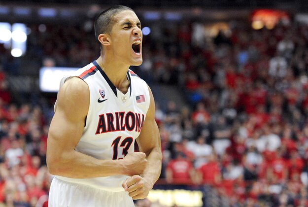 Jan 4, 2014; Tucson, AZ, USA; Arizona Wildcats guard Nick Johnson (13) celebrates during the first half against the Washington Huskies at McKale Center. Mandatory Credit: Casey Sapio-USA TODAY Sports Jan 4, 2014; Tucson, AZ, USA; Arizona Wildcats guard Nick Johnson (13) celebrates during the first half against the Washington Huskies at McKale Center. Mandatory Credit: Casey Sapio-USA TODAY Sports