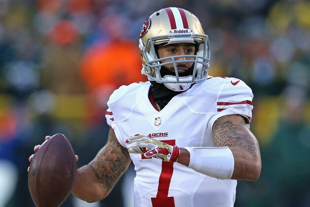 GREEN BAY, WI - JANUARY 05: Colin Kaepernick #7 of the San Francisco 49ers rolls out to look for a receiver against the Green Bay Packers during an NFC Wild Card Playoff game at Lambeau Field on January 5, 2014 in Green Bay, Wisconsin. The 49ers defeated the Packers 23-20.  (Photo by Jonathan Daniel/Getty Images)