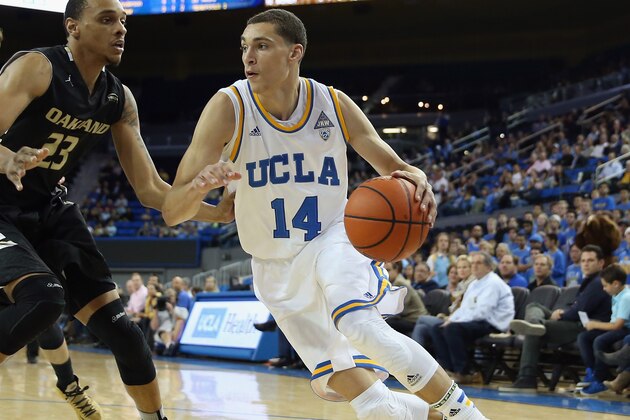 LOS ANGELES, CA - NOVEMBER 12:  Zach LaVine #14 of the UCLA Bruins drives to the basket past Tommie McCune #23 of the Oakland Golden Grizzlies in the first half at Pauley Pavilion on November 12, 2013 in Los Angeles, California.  (Photo by Jeff Gross/Getty Images)