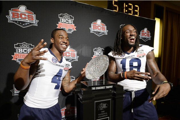 NEWPORT BEACH, CA - JANUARY 4:  Quan Bray #4 and Sammie Coates #18 of the Auburn Tigers pose with The Coches Trophy during the Vizio BCS National Championship media day January 4, 2014 in Newport Beach, California.  (Photo by Kevork Djansezian/Getty Images)