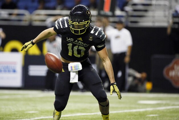 Jan 4, 2014; San Antonio, TX, USA; East quarterback Jacob Park (10) recovers his own fumble during U.S. Army All-American Bowl high school football game at the Alamodome. Mandatory Credit: Soobum Im-USA TODAY Sports