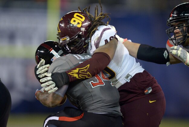 Dec 30, 2013; San Diego, CA, USA; Arizona State Sun Devils defensive tackle Will Sutton (90) tackles Texas Tech Red Raiders running back Kenny Williams (34) during the 2013 Holiday Bowl at Qualcomm Stadium. Texas Tech defeated Arizona State 37-23. Mandatory Credit: Kirby Lee-USA TODAY Sports