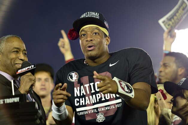 Jan 6, 2014; Pasadena, CA, USA; Florida State Seminoles quarterback Jameis Winston (5) celebrates after winning the 2014 BCS National Championship game against Auburn Tigers 34-31 at the Rose Bowl.  Mandatory Credit: Richard Mackson-USA TODAY Sports