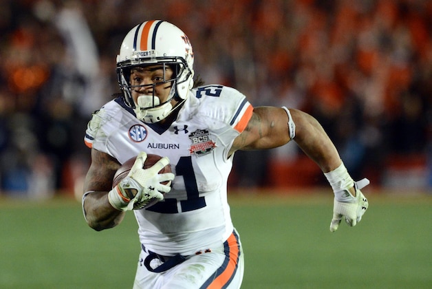 Jan 6, 2014; Pasadena, CA, USA; Auburn Tigers running back Tre Mason (21) scores a touchdown against the Florida State Seminoles during the second half of the 2014 BCS National Championship game at the Rose Bowl.  Mandatory Credit: Jayne Kamin-Oncea-USA TODAY Sports