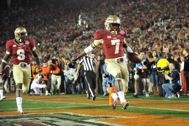 Jan 6, 2014; Pasadena, CA, USA; Florida State Seminoles wide receiver Kermit Whitfield (7) scores a touchdown during the second half of the 2014 BCS National Championship game against the Auburn Tigers at the Rose Bowl.  Mandatory Credit: Gary A. Vasquez-USA TODAY Sports