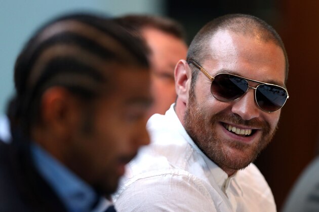 LONDON, ENGLAND - JULY 11:  Tyson Fury (R) speaks beside David Haye during a press conference to announce their upcoming  title fight on July 11, 2013 in London, England.  (Photo by Clive Rose/Getty Images)